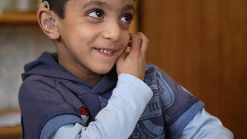 young person with a hearing aid