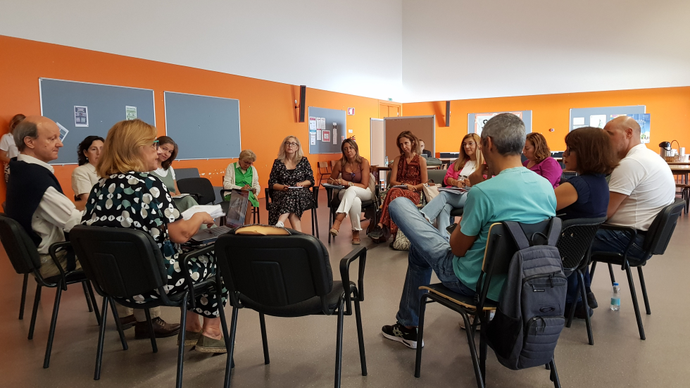 A group of people sit in a circle