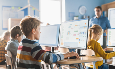 Children using computers in a classroom