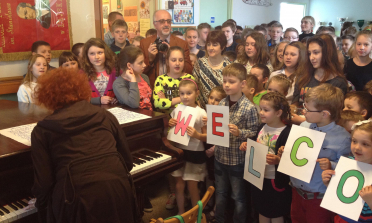 young students receiving project participants in a school