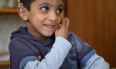 photo of a young person with a hearing aid