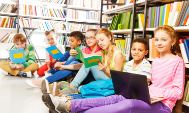 Children reading books in a library