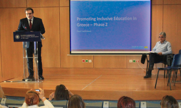 Minister of Education, Kyriakos Pierrakakis, delivers his opening speech at the conference, with Giannis Bousdounis, Director of the Department of Special Needs, seated to his right