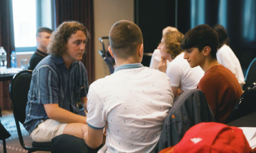 Three young people having a discussion