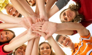 young people forming a circle