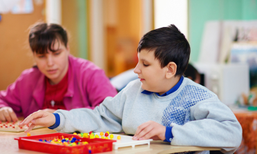 two young people in classroom environment