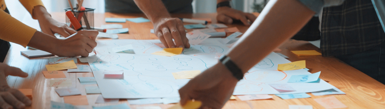 image of people at a table planning