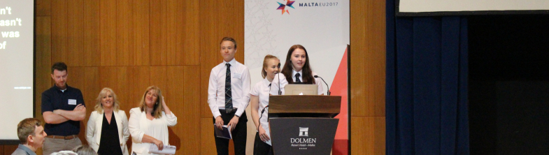 students speaking at the event in Malta