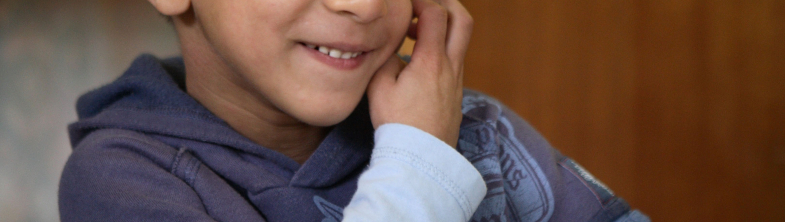 photo of a young person with a hearing aid