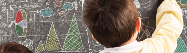 children writing on a blackboard